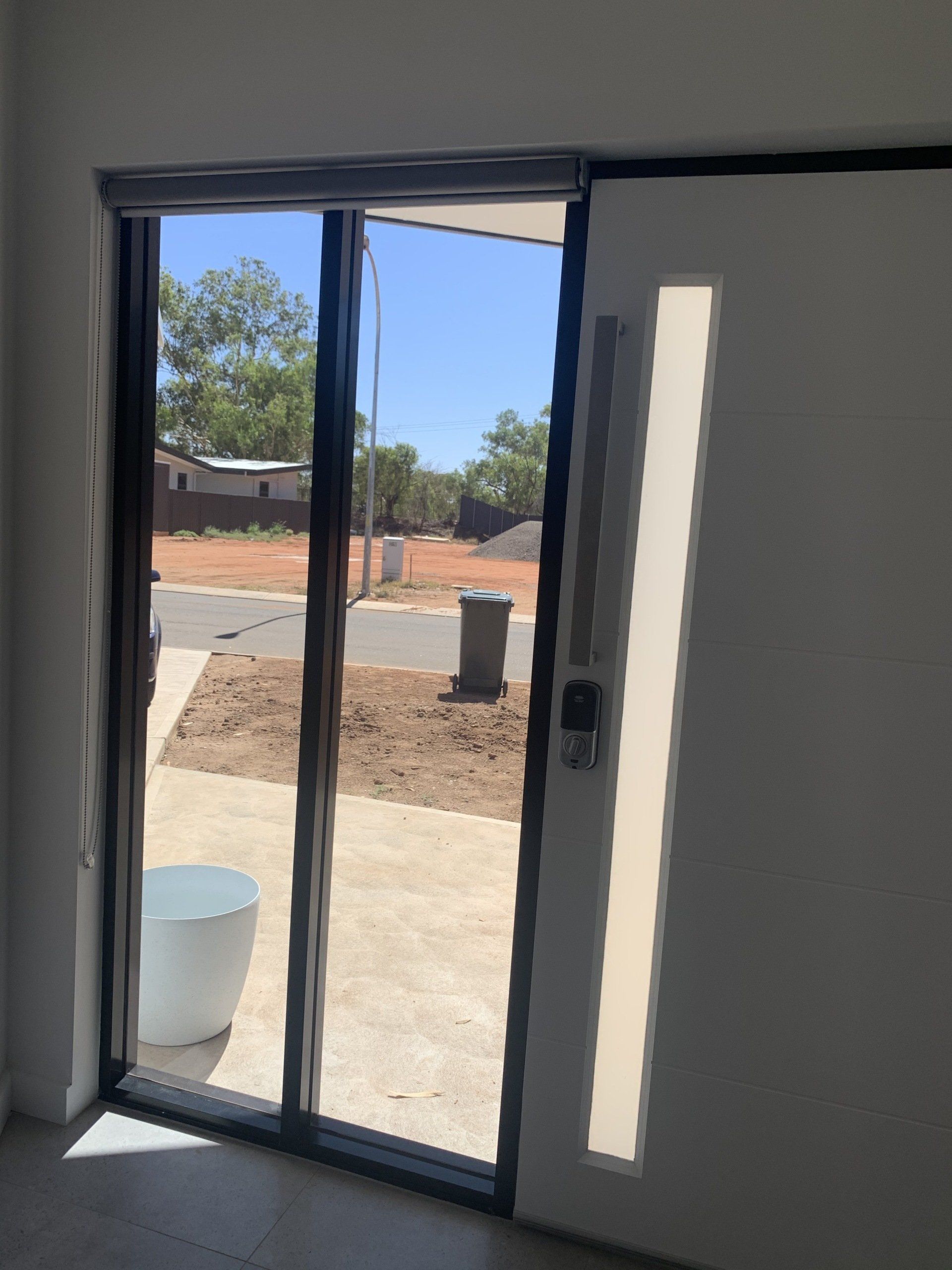 Sliding Glass Door and White Door with A Window Panel — Alice Mobile Blinds in Ciccone, NT