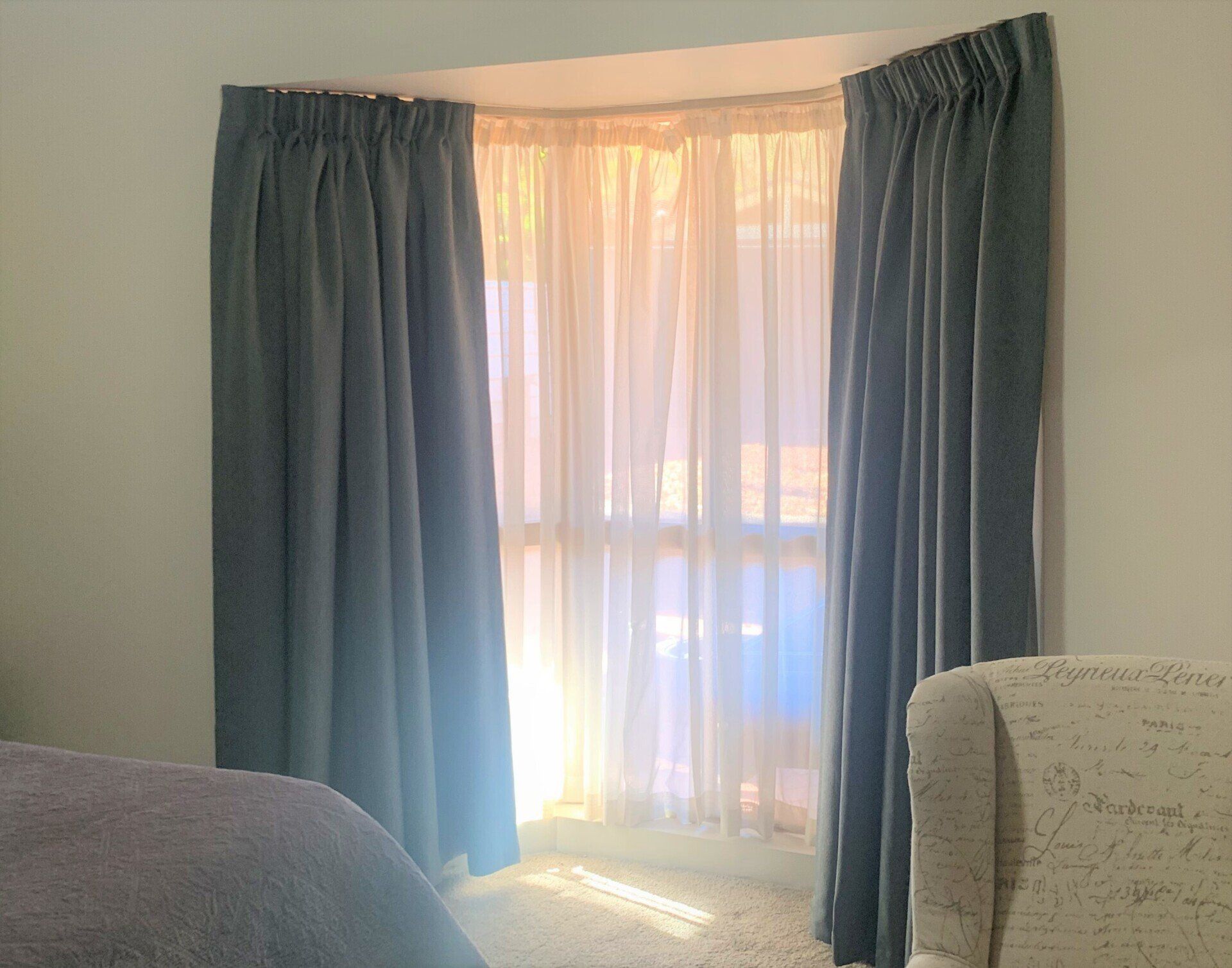 Window with Dark Blue Curtains and Sheer White Curtains — Alice Mobile Blinds in Ciccone, NT