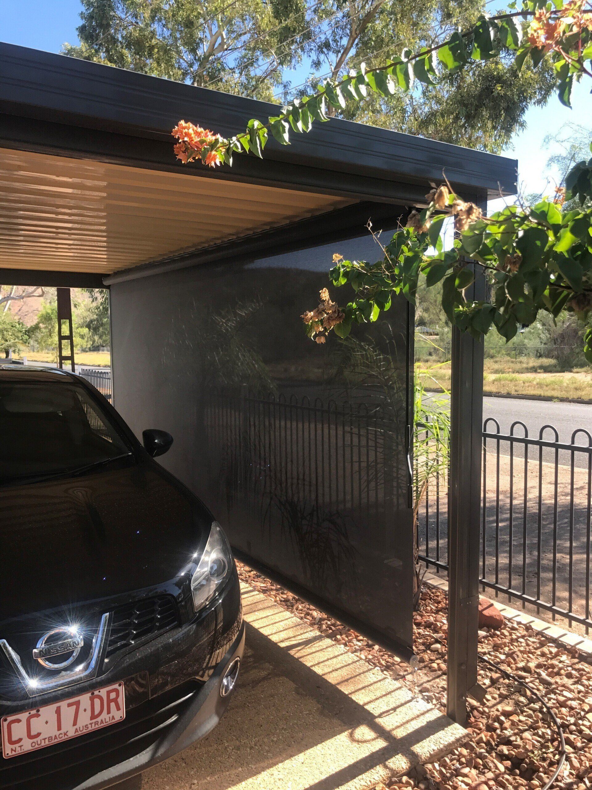 Black Car Under a Carport with A Dark Shade — Alice Mobile Blinds in Ciccone, NT