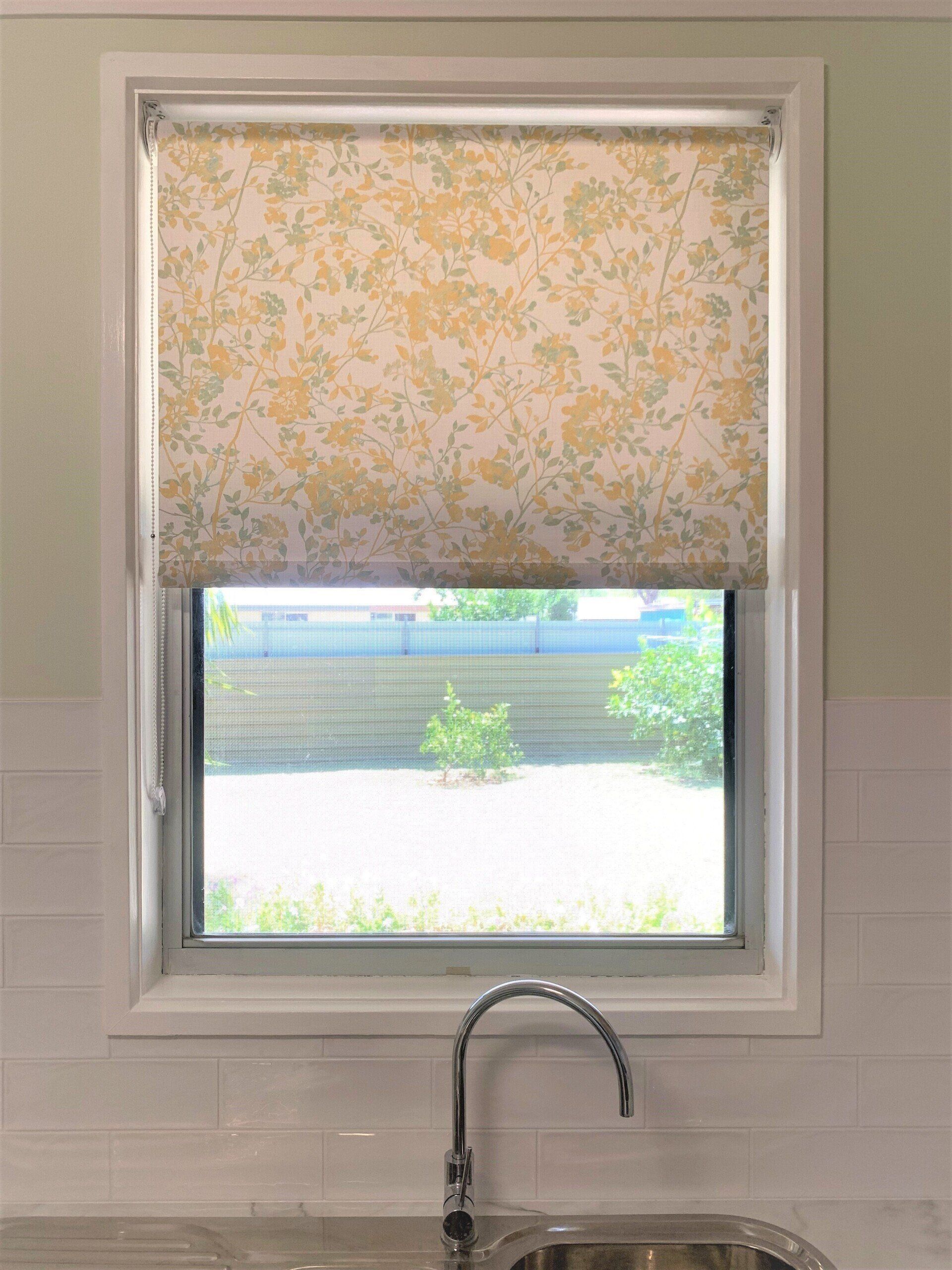 Kitchen Window with Floral Print Shade Partially Lowered — Alice Mobile Blinds in Ciccone, NT