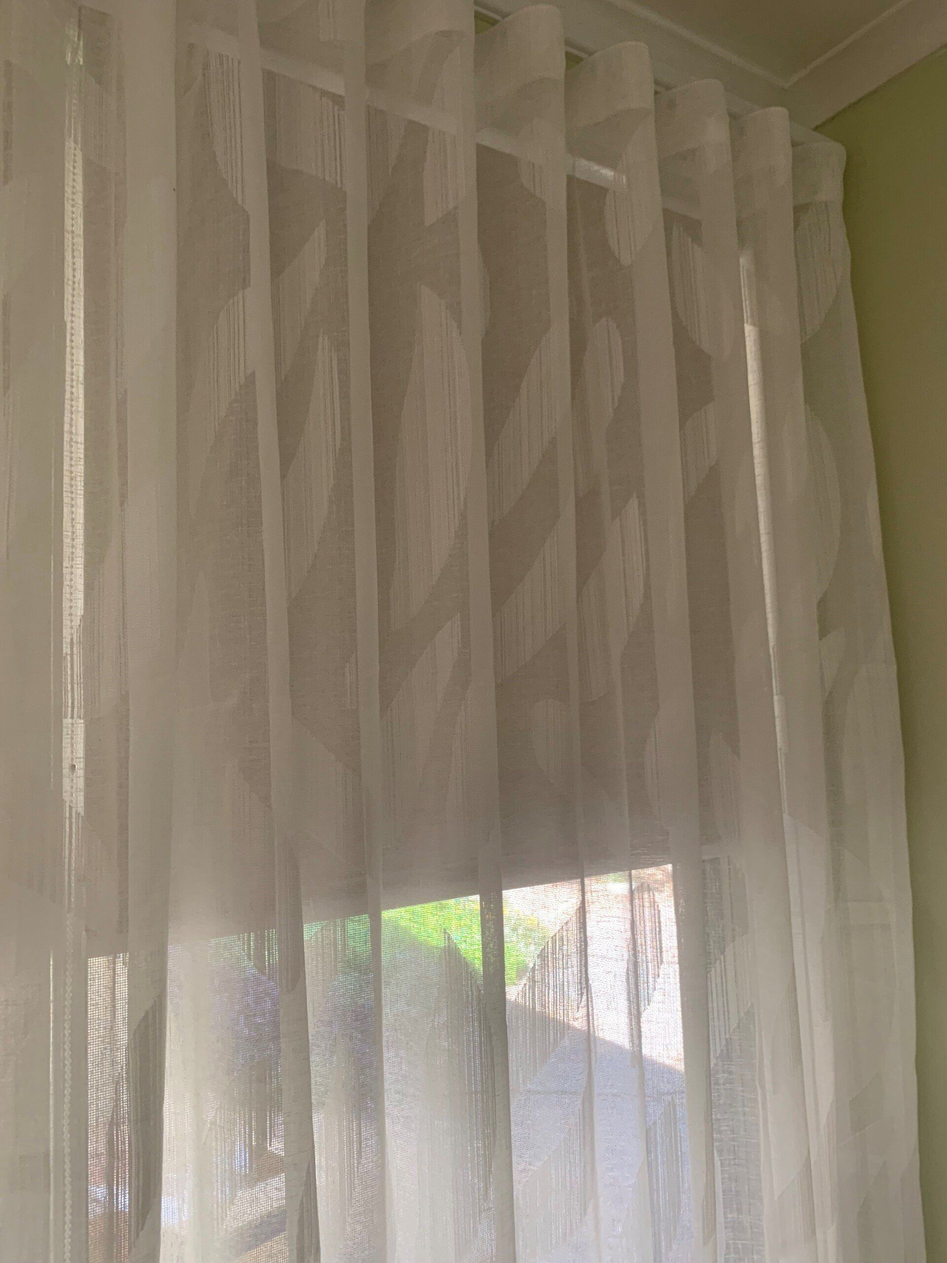 White Sheer Curtains Hanging Over a Window — Alice Mobile Blinds in Ciccone, NT