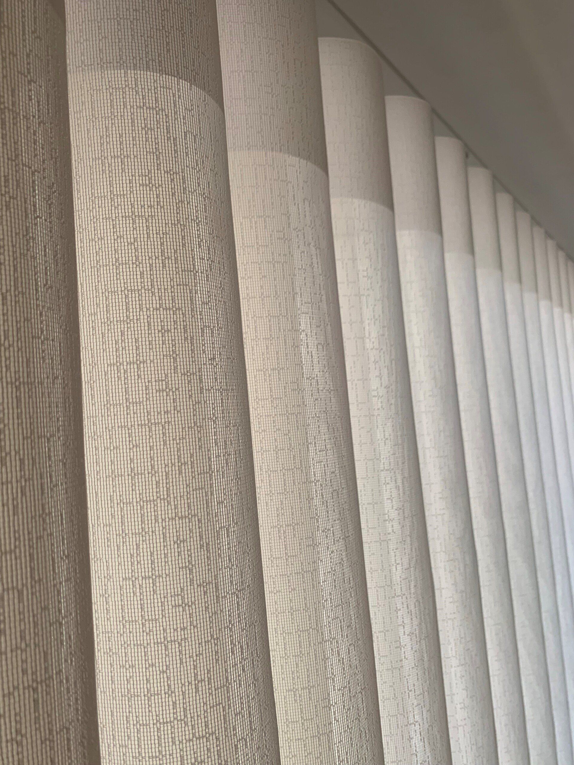 Beige Vertical Blinds Filtering Sunlight Creating Shadows — Alice Mobile Blinds in Ciccone, NT
