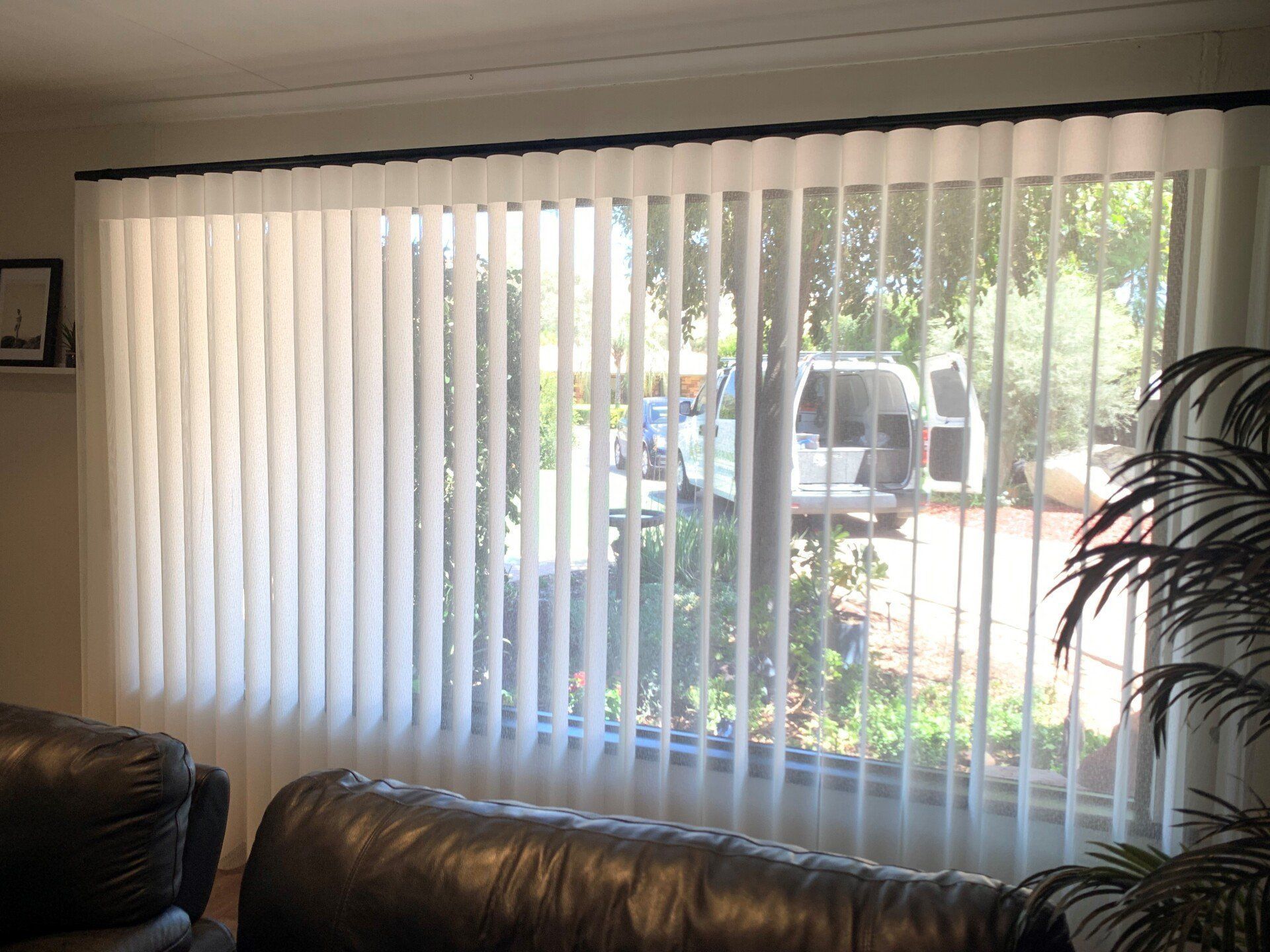 White Vertical Blinds Cover a Large Window — Alice Mobile Blinds in Ciccone, NT
