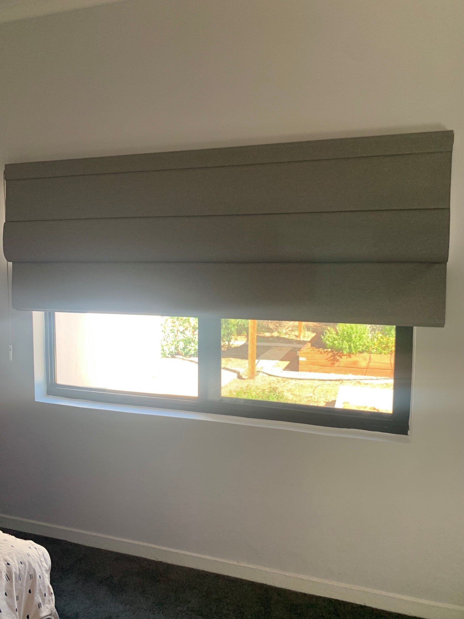 Grey Roman Shade Over a Window — Alice Mobile Blinds in Ciccone, NT