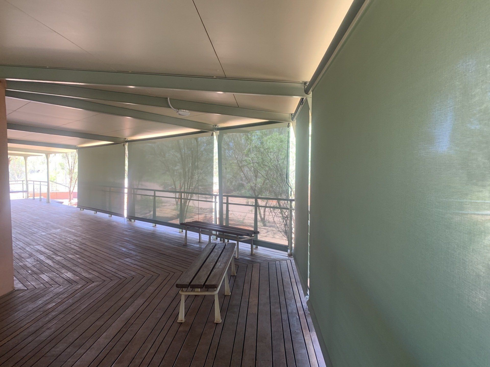 Covered Wooden Deck with Outdoor Blinds — Alice Mobile Blinds in Ciccone, NT