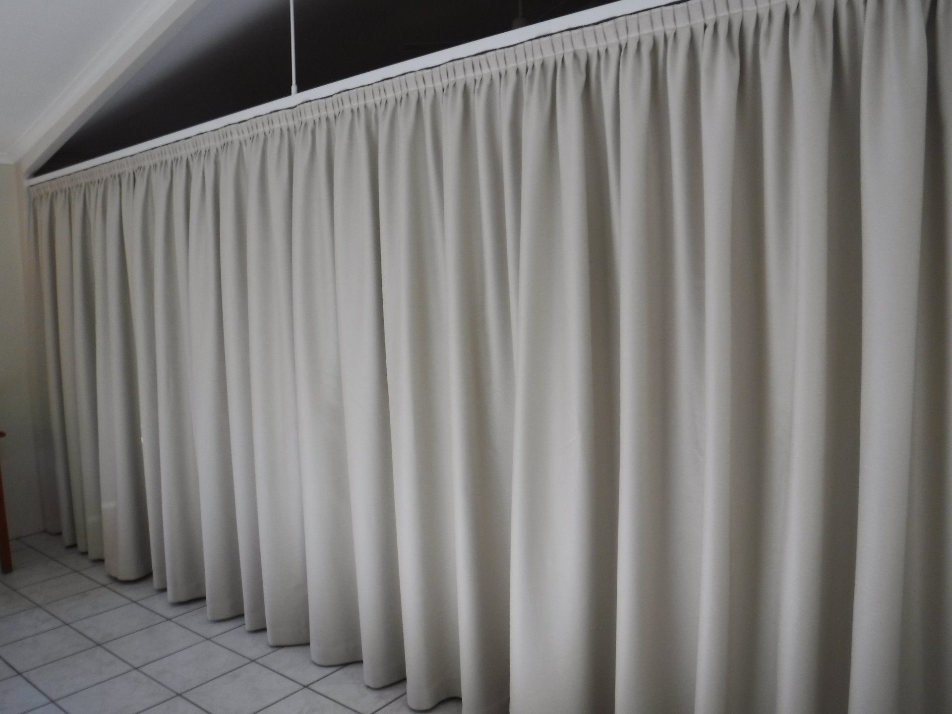 Beige Pleated Curtains Hanging from A Track — Alice Mobile Blinds in Ciccone, NT