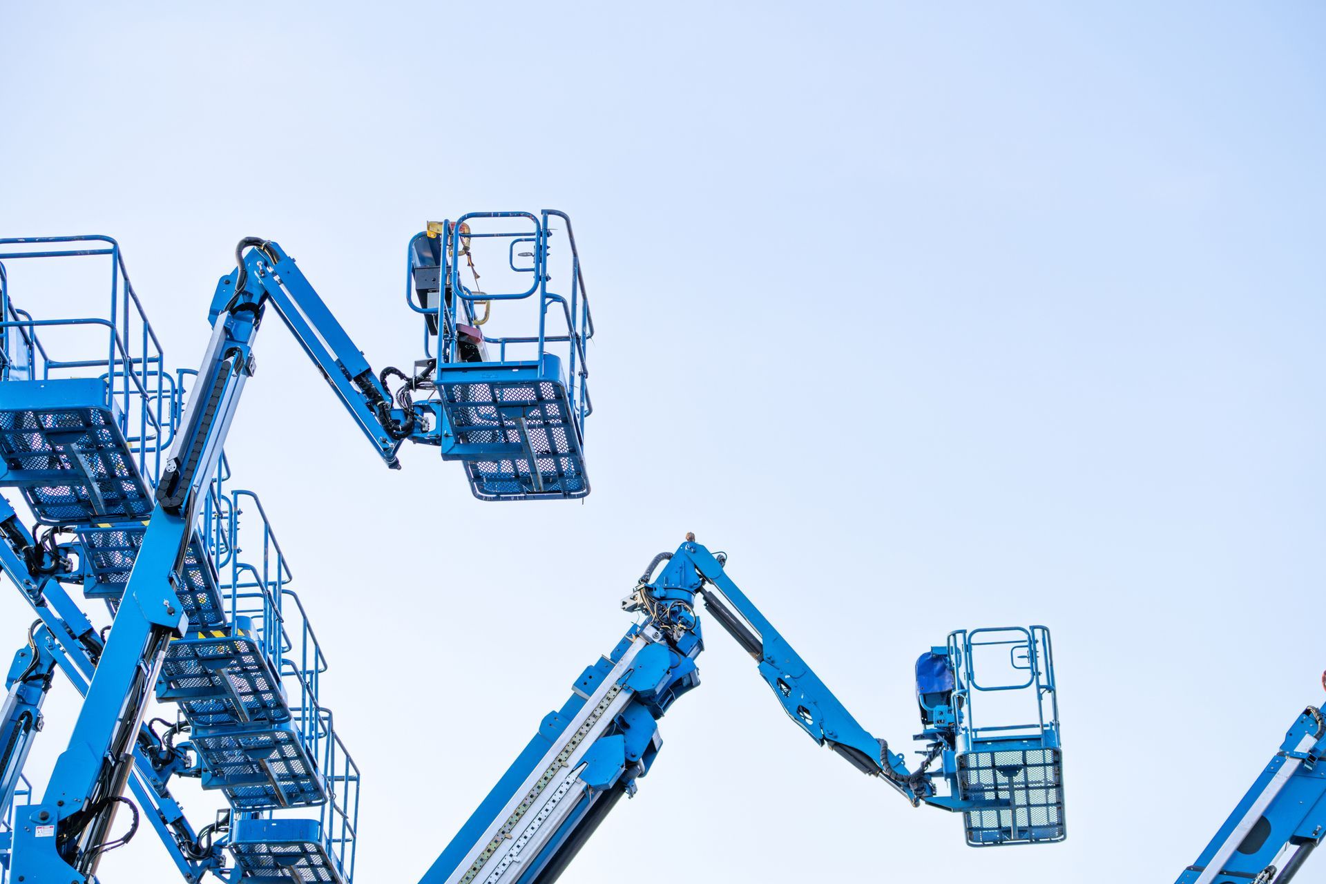 High-tech mobile construction crane rental with clear blue sky in the background.