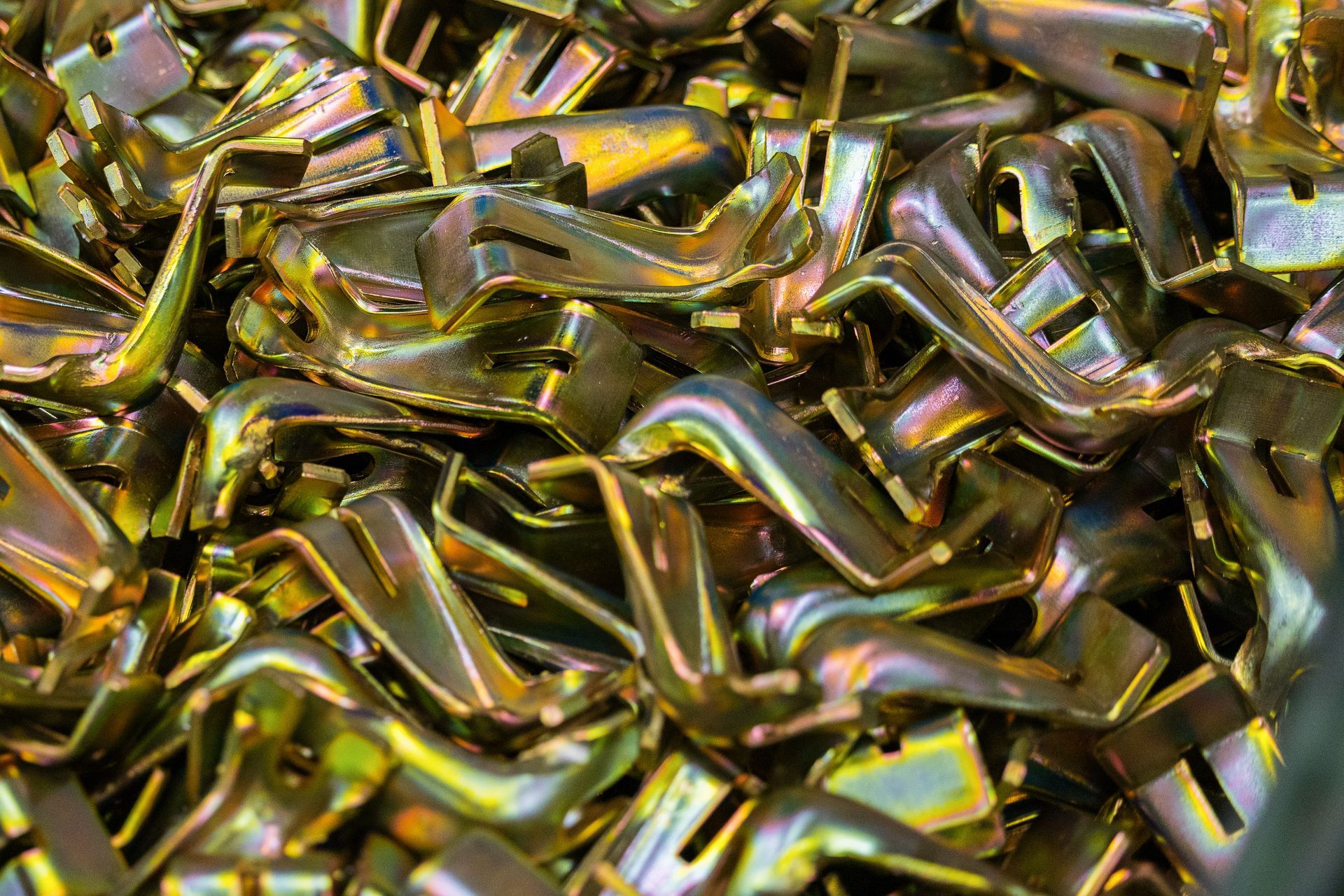 A close up of a pile of metal pieces