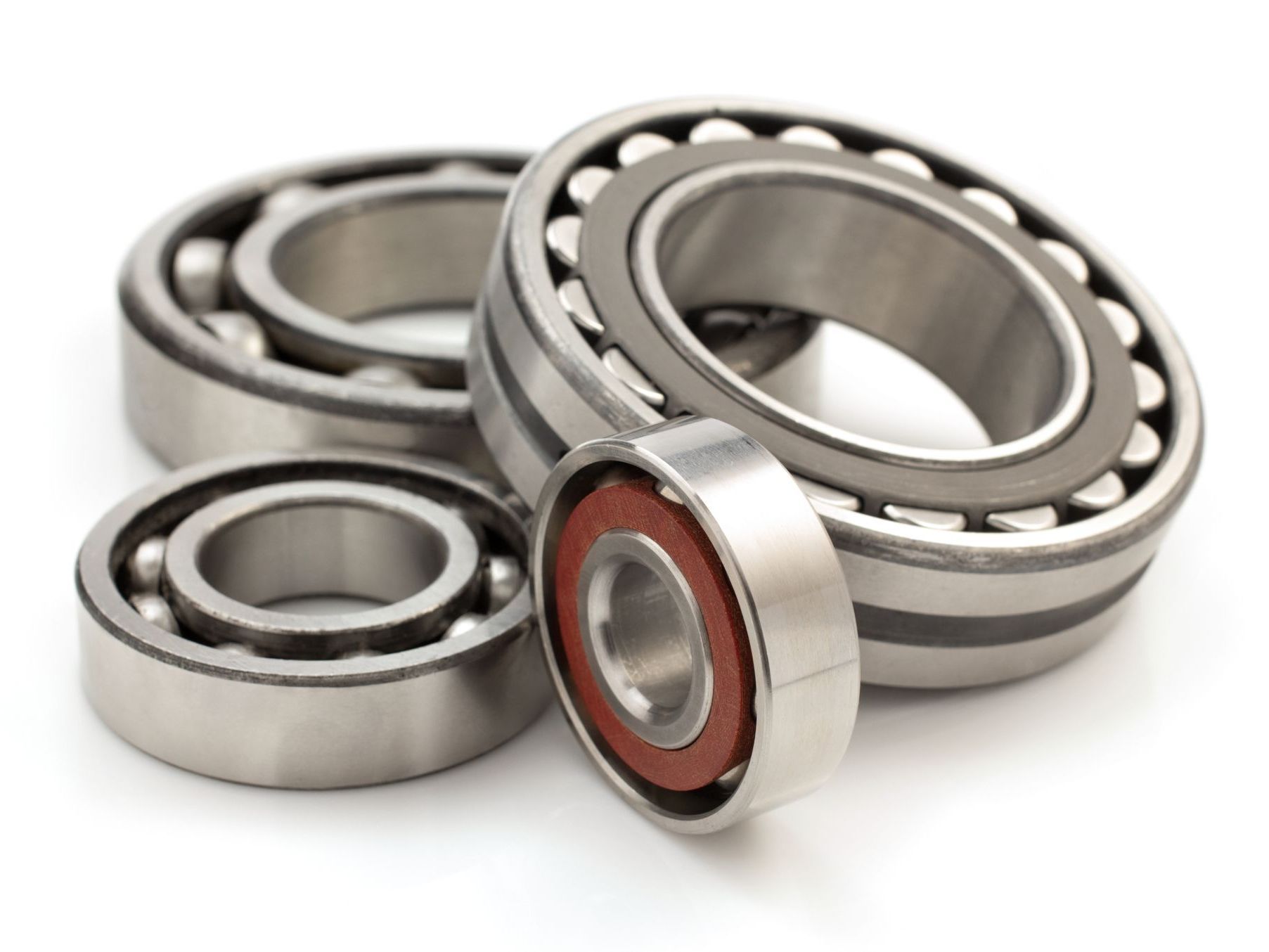 A group of bearings are stacked on top of each other on a white background