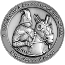 A coin with a knight riding a horse on it.