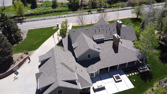 Elegant slate shingles on a home by Kudu Roofing