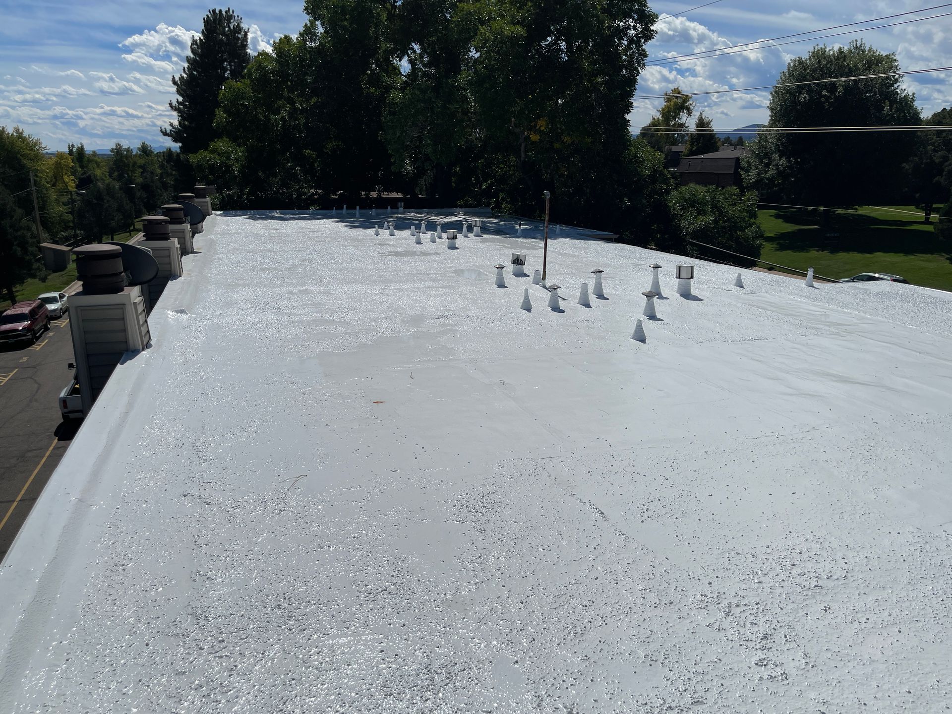 Efficient commercial low sloped roof by Kudu Roofing.