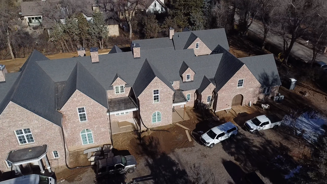 Commercial slate shingle roof by Kudu Roofing.