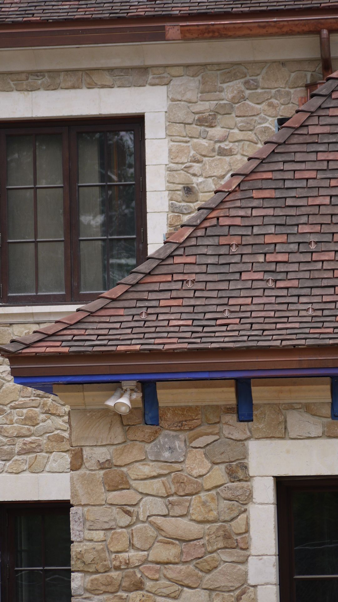 Durable clay roof tiles installed on a commercial building.