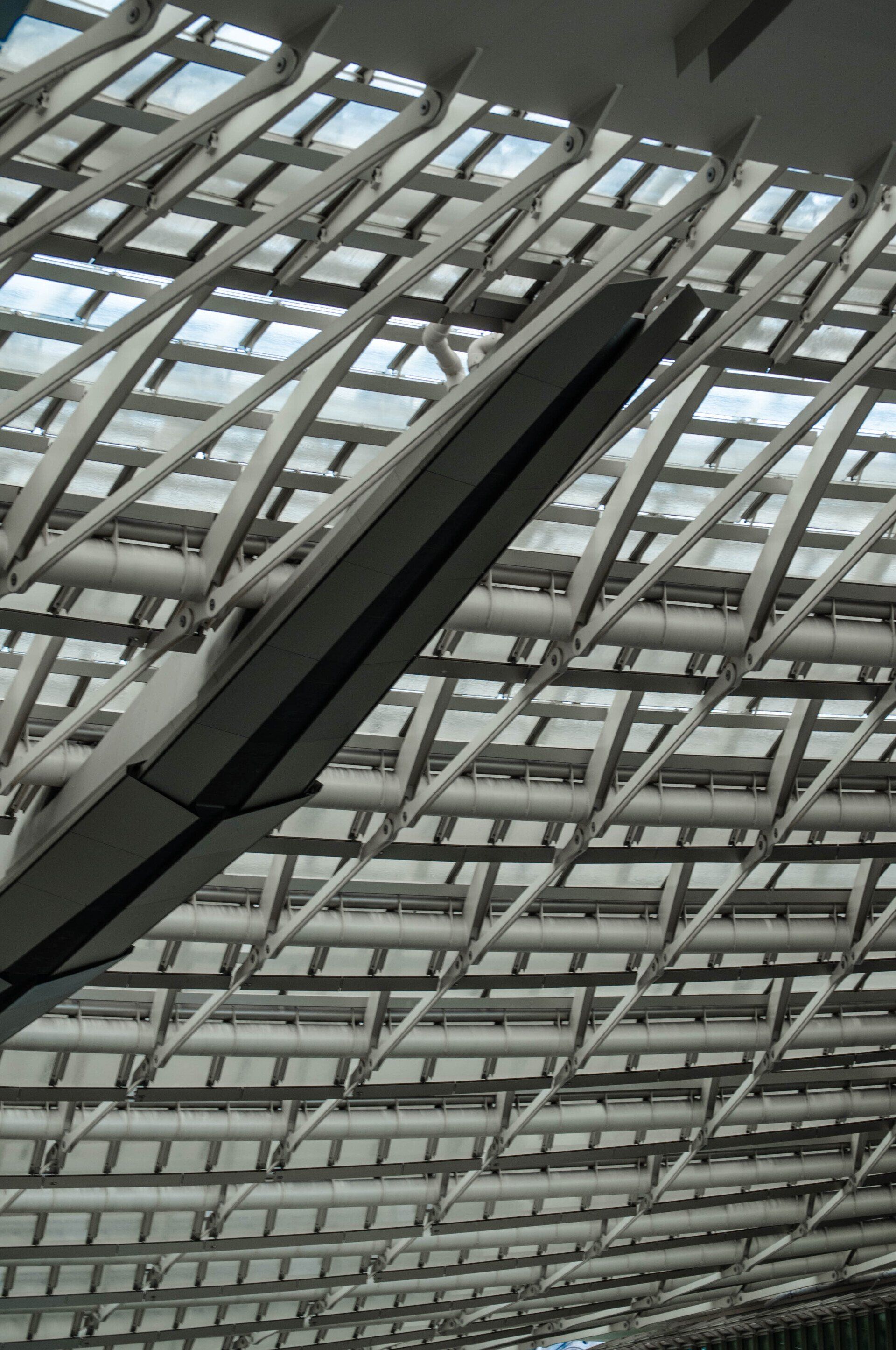 Looking up at the ceiling of a building with a lot of windows