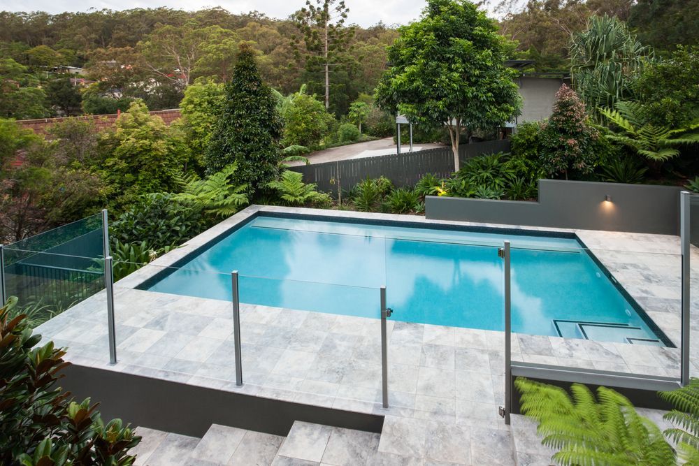 A Large Swimming Pool With Stairs Leading Up To It — Holiday Coast Pools & Water In Bellengin, NSW