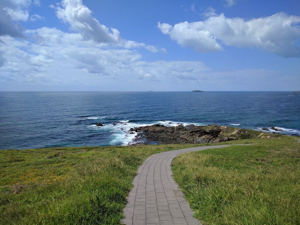 A Path Leading To The Ocean On A Sunny Day — Holiday Coast Pools & Water In Woolgoolga, NSW