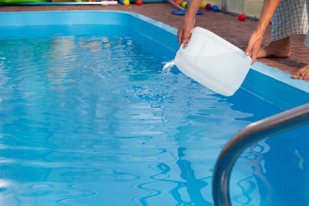Adding Chemicals on Pool for Cleaning