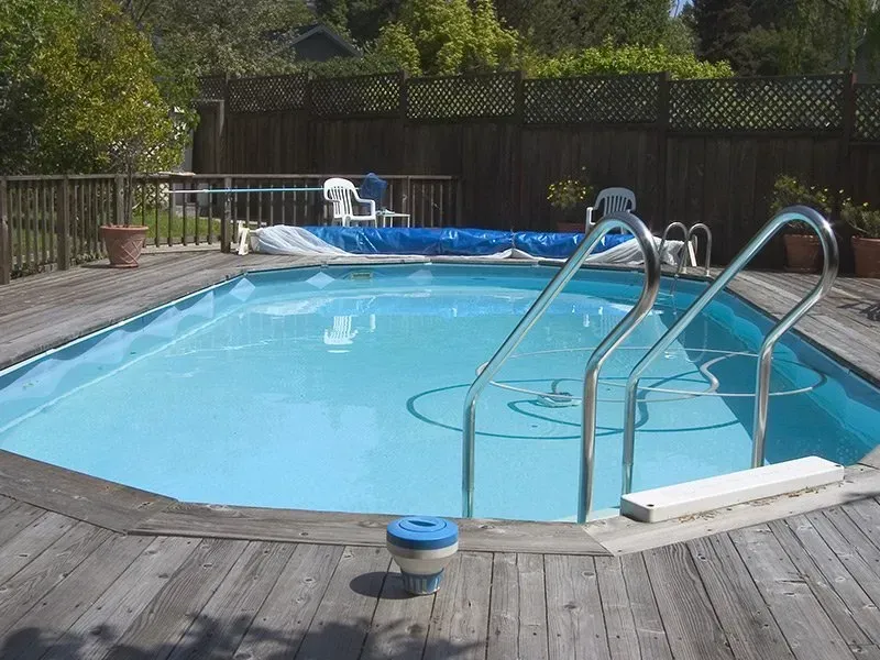 A Large Swimming Pool With Stairs Leading To It — Holiday Coast Pools & Water In Sawtell, NSW