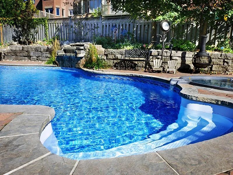 A Large Swimming Pool With Stairs Leading To It — Holiday Coast Pools & Water In Coffs Harbour, NSW
