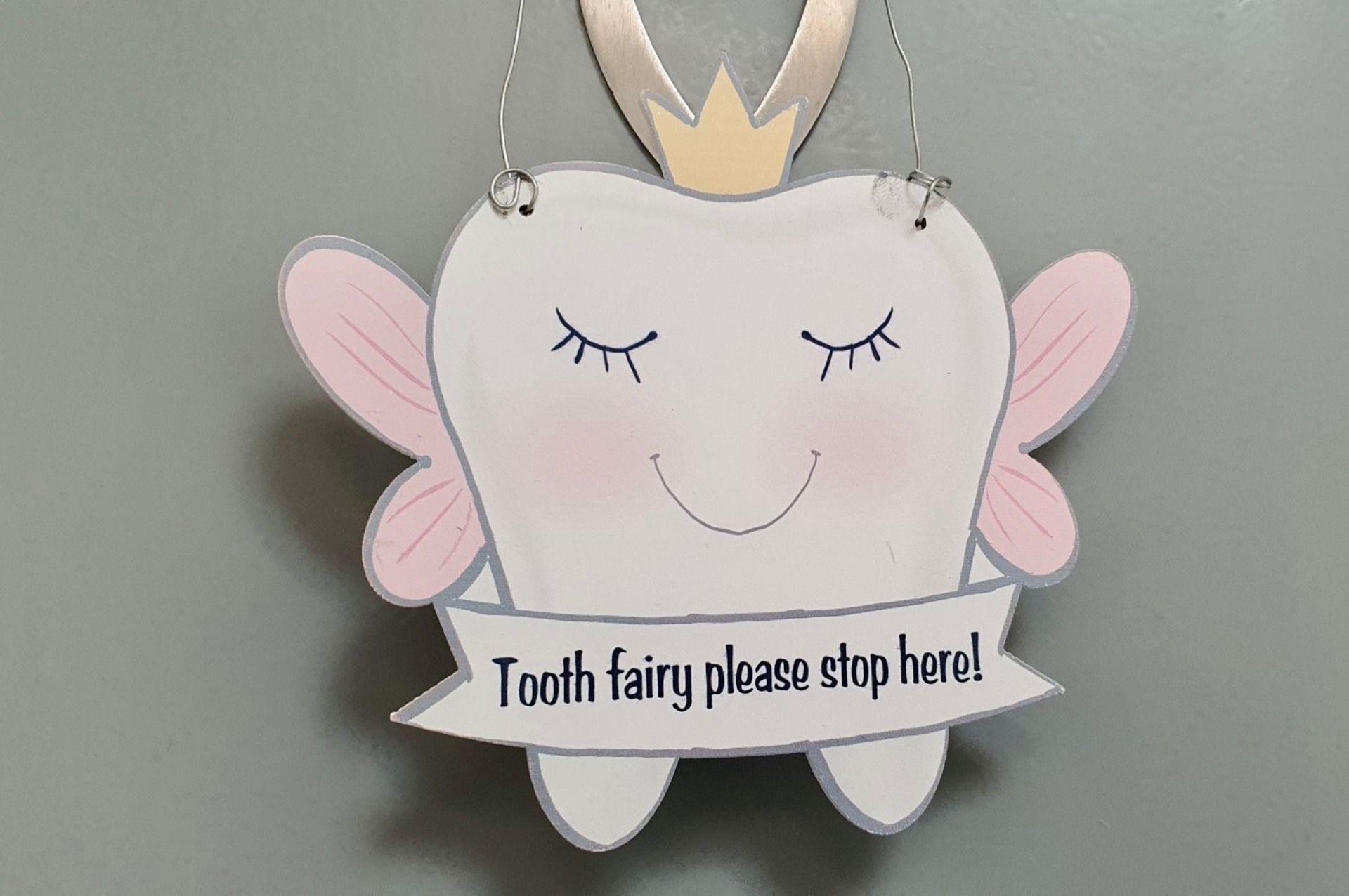A tooth fairy sign that says tooth fairy please stop here