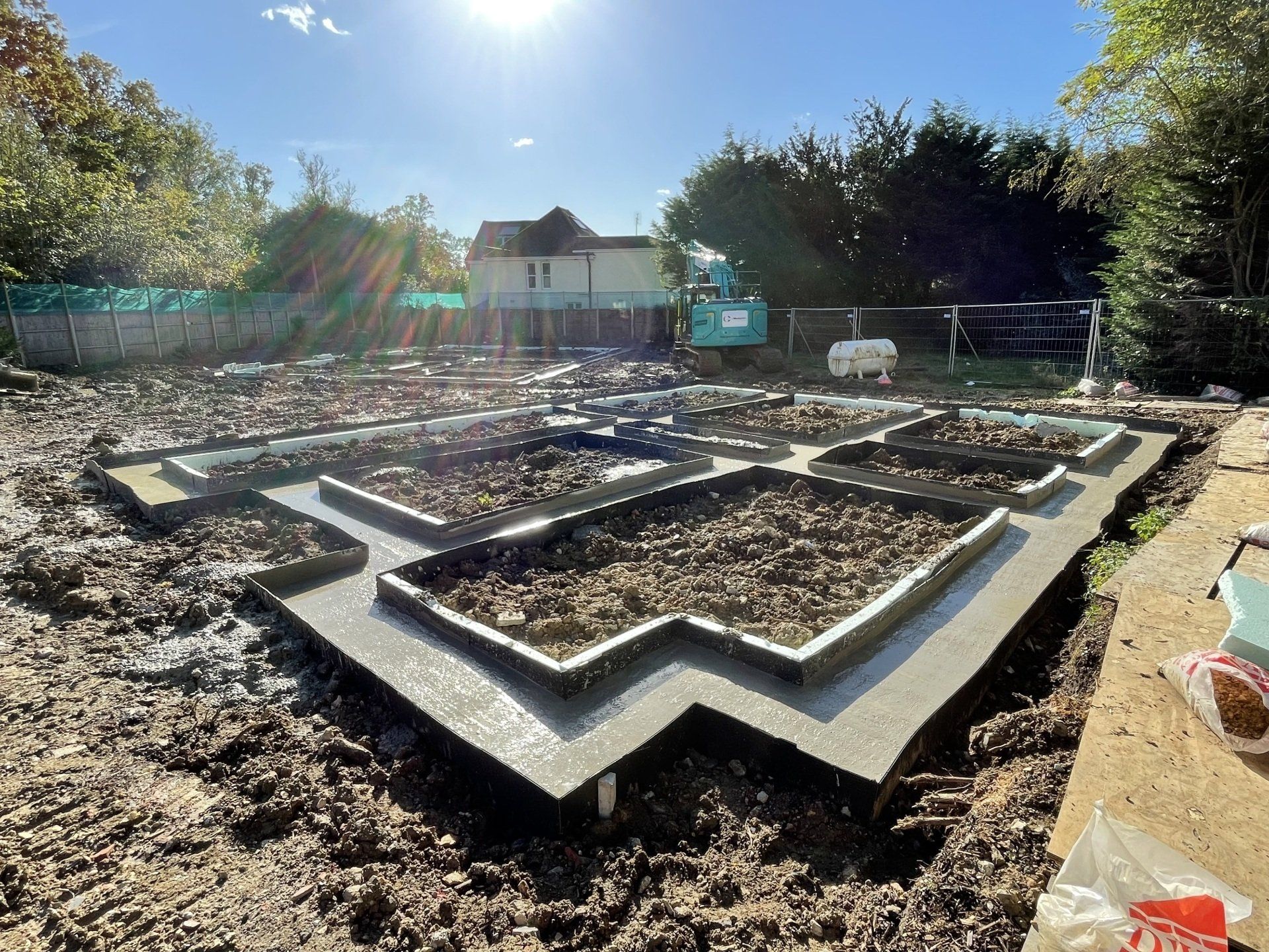 teal coloured Groundworks360 Ltd plant machinery
