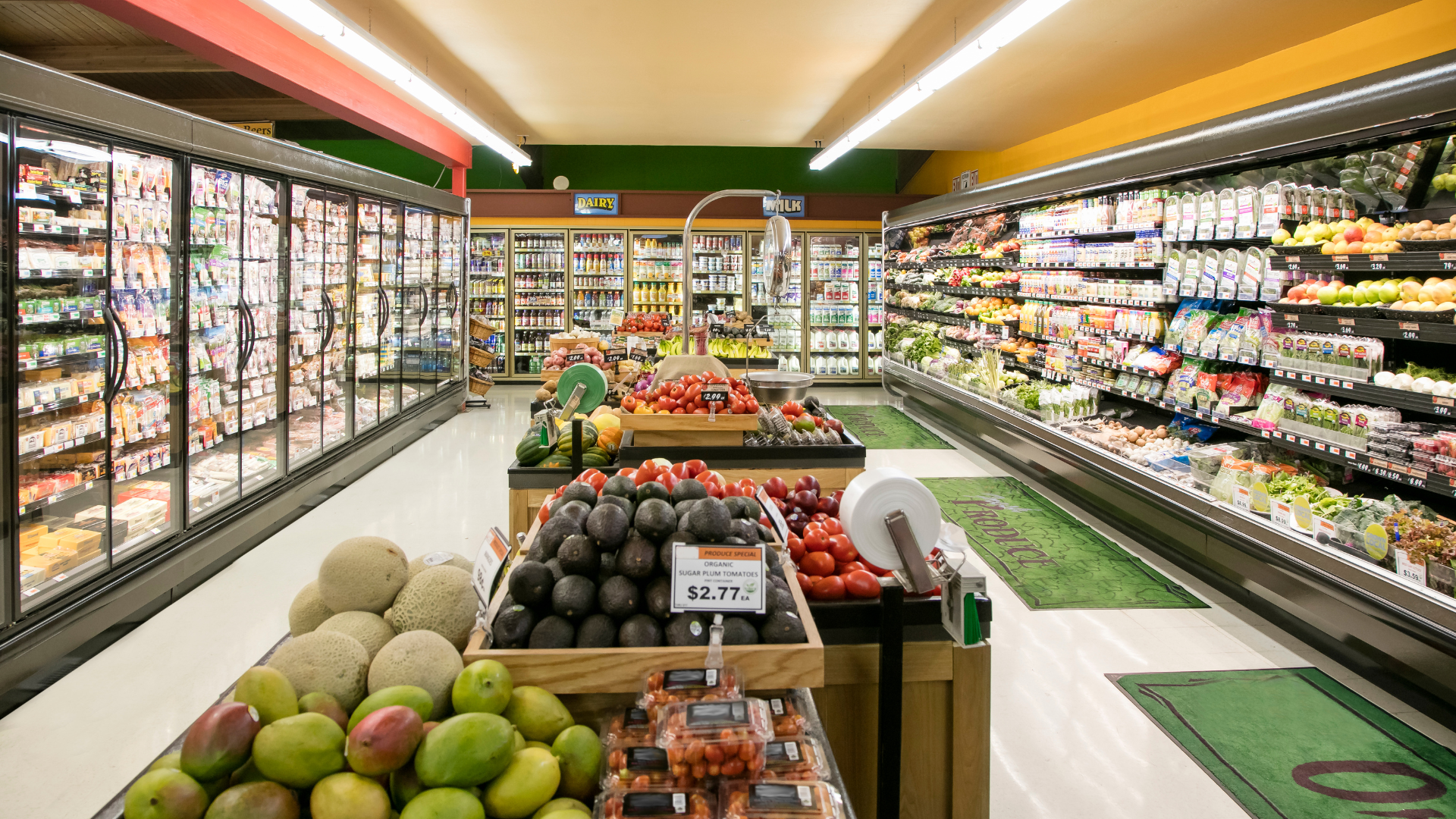 The inside of a grocery store filled with fruits and vegetables.