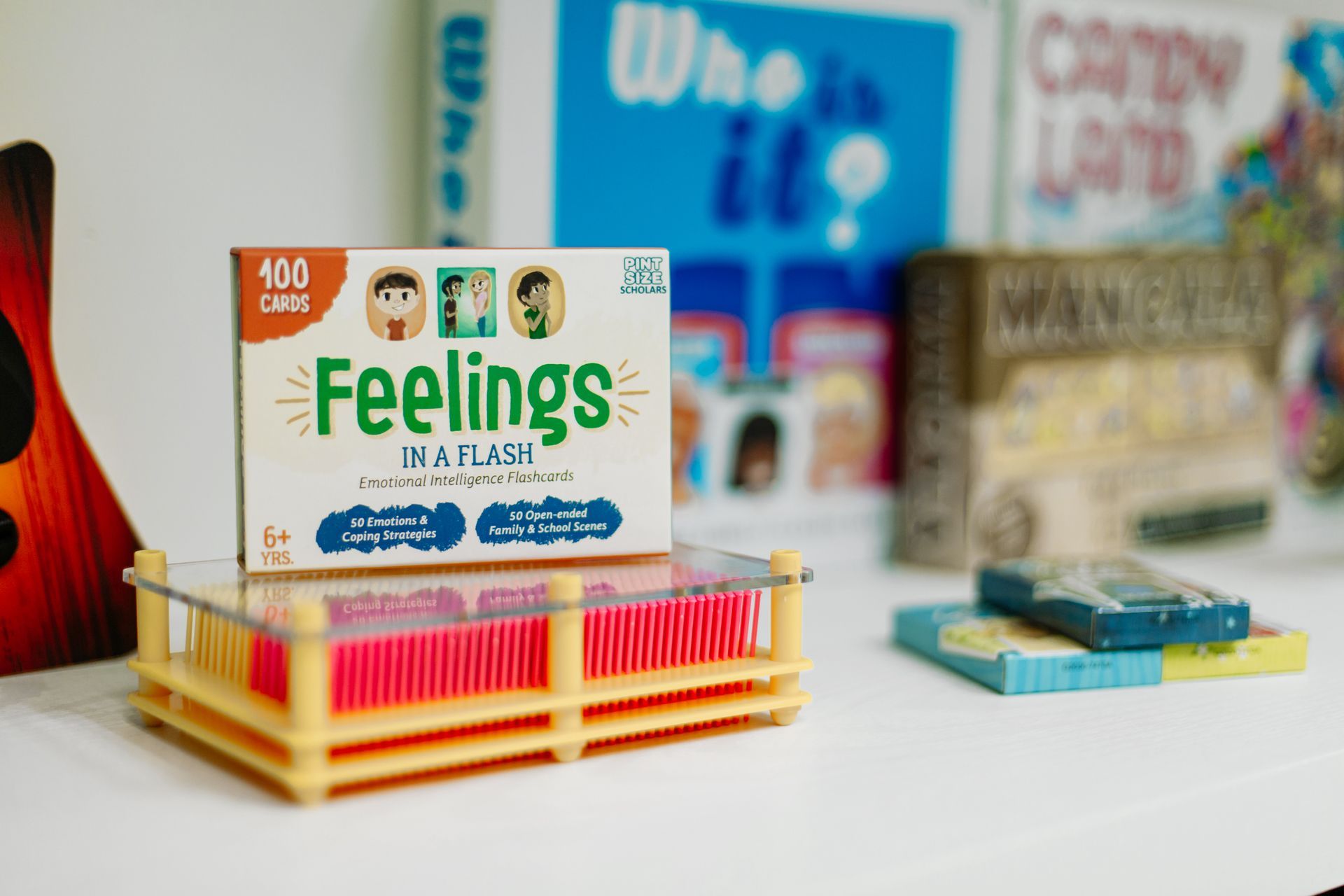 A box of feelings cards is sitting on a table.