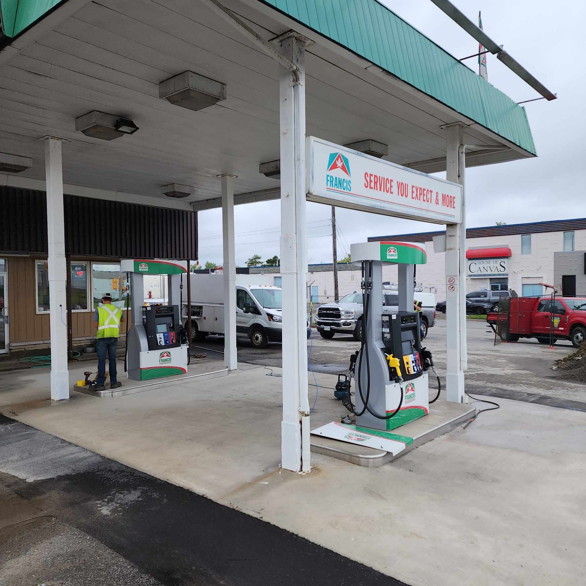 A gas station with a sign that says service you comfort & more