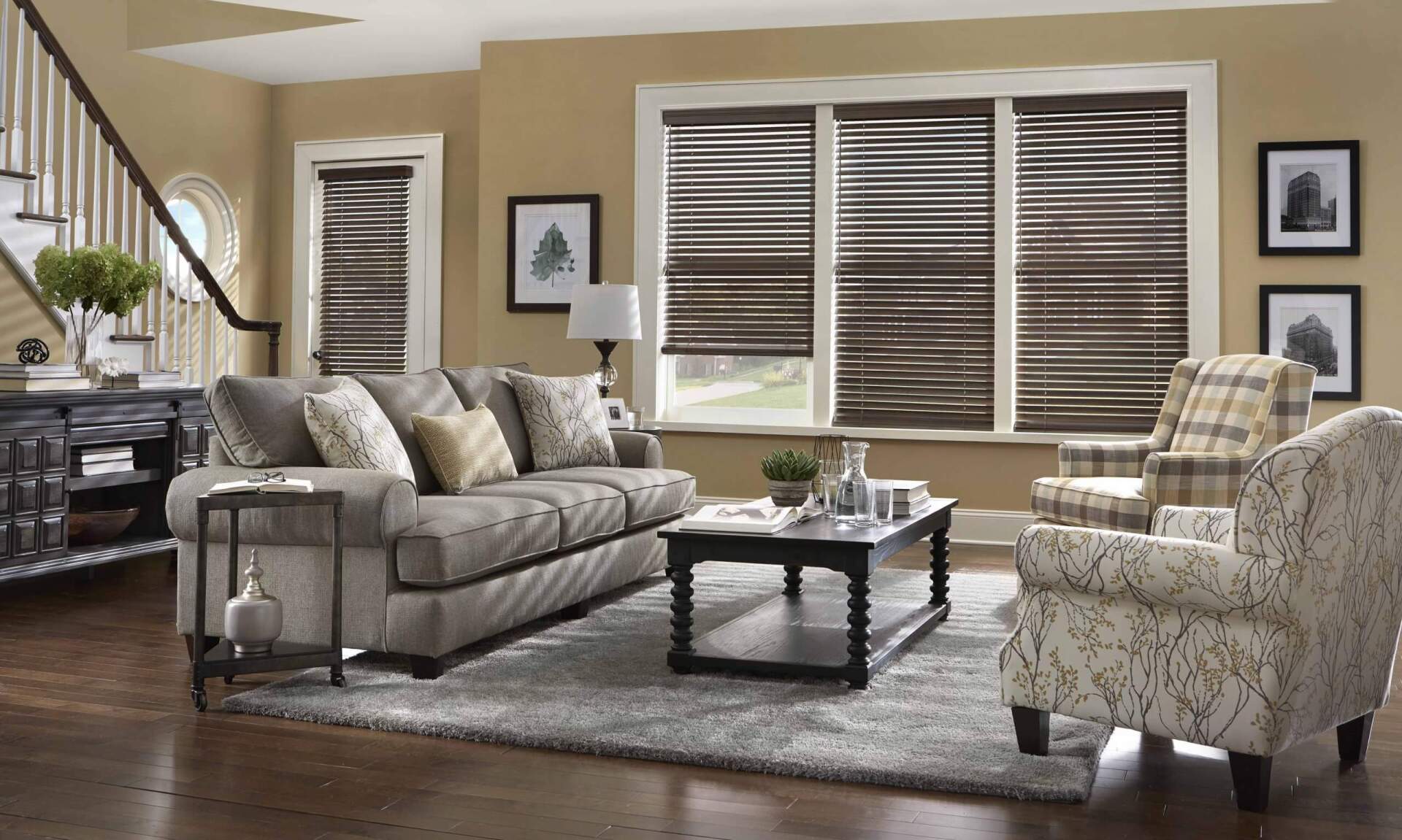 A living room with a couch , chairs , coffee table and blinds. Love is Blinds Arizona (844) 936-2446