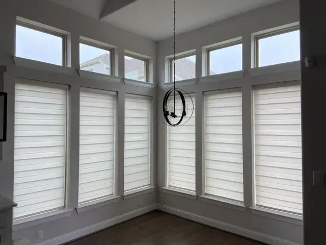 A room with a lot of windows and a chandelier hanging from the ceiling. Love is Blinds Arizona (844) 936-2446