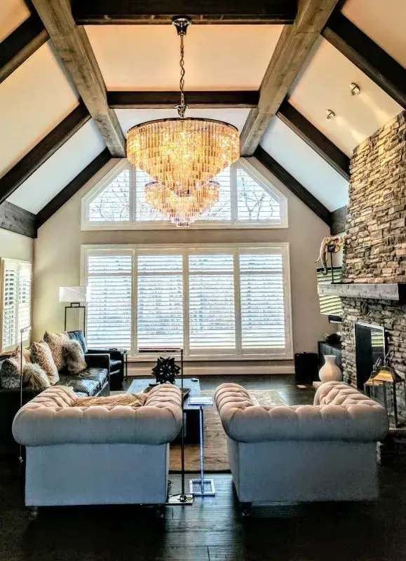 A living room with a chandelier hanging from the ceiling Love is Blinds Arizona (844) 936-2446