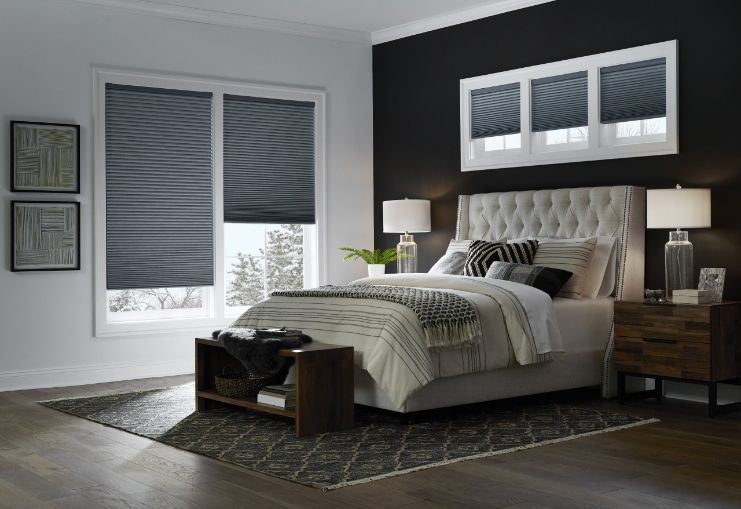 A bedroom with a bed , nightstand , and window shades. Love is Blinds Arizona (844) 936-2446