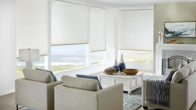 A living room with a couch , chairs , coffee table and fireplace. Love is Blinds Michigan
