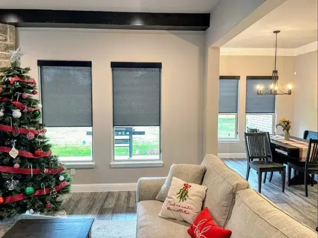 A living room with a couch and a christmas tree Love is Blinds Michigan