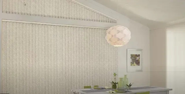 A dining room with a table and chairs and vertical blinds on the wall. Love is Blinds Arizona (844) 936-2446