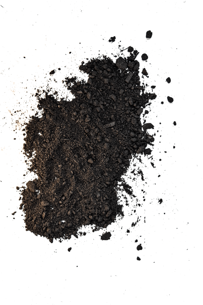 Pile of dark soil or compost on a white background