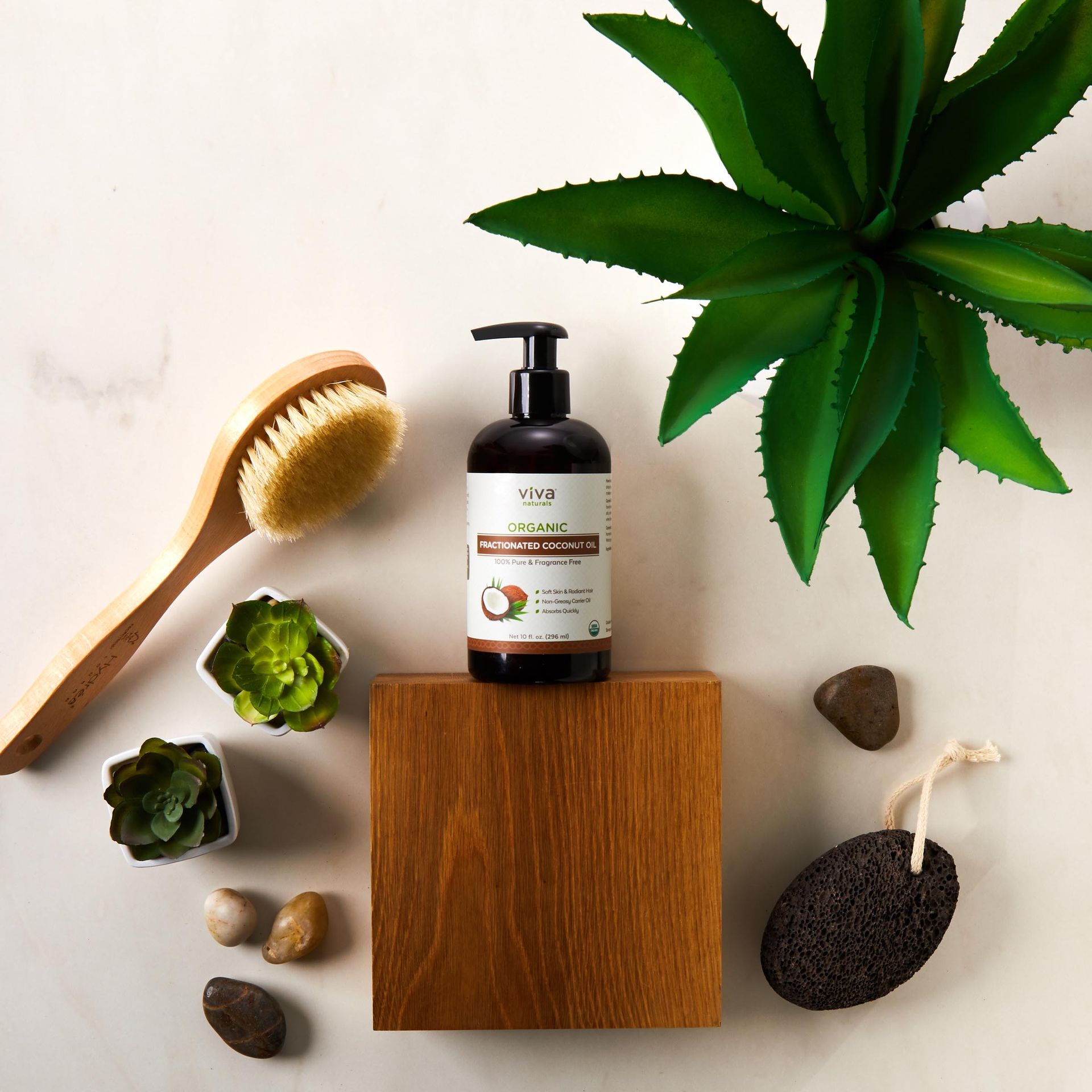 A bottle of lotion is sitting on a wooden box