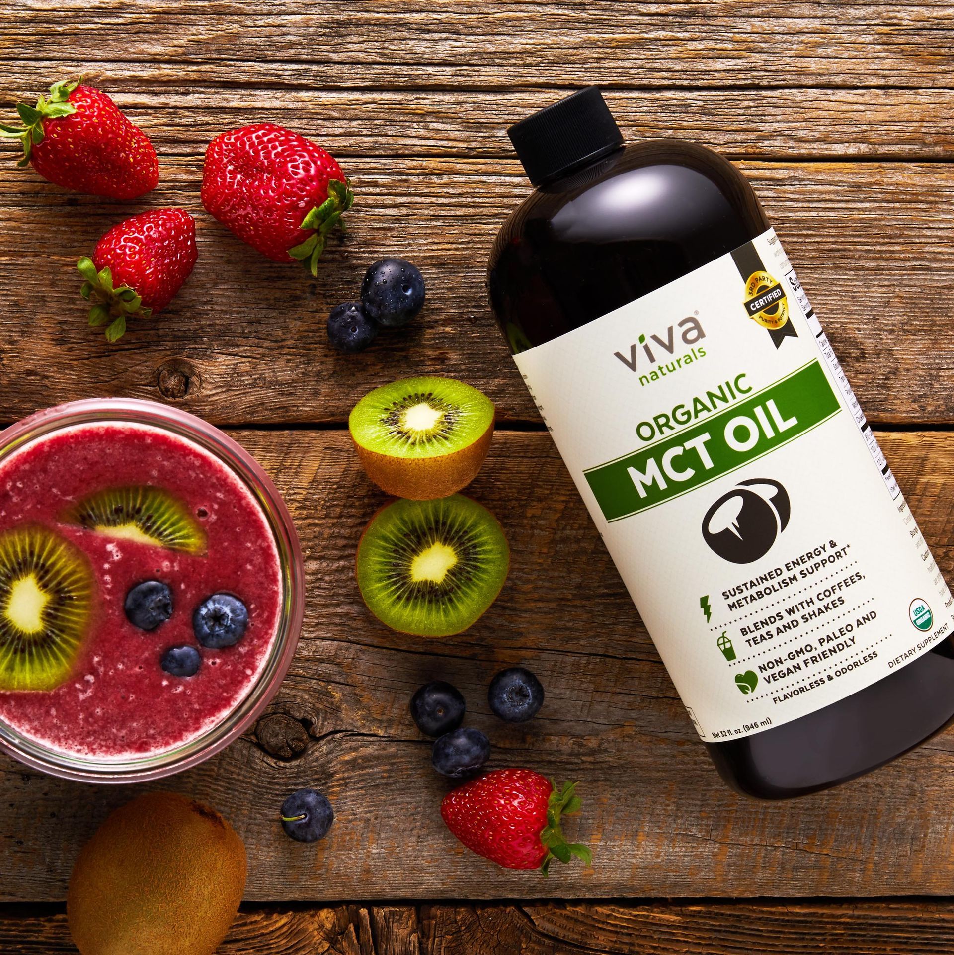 A bottle of viva organic mct oil surrounded by fruit