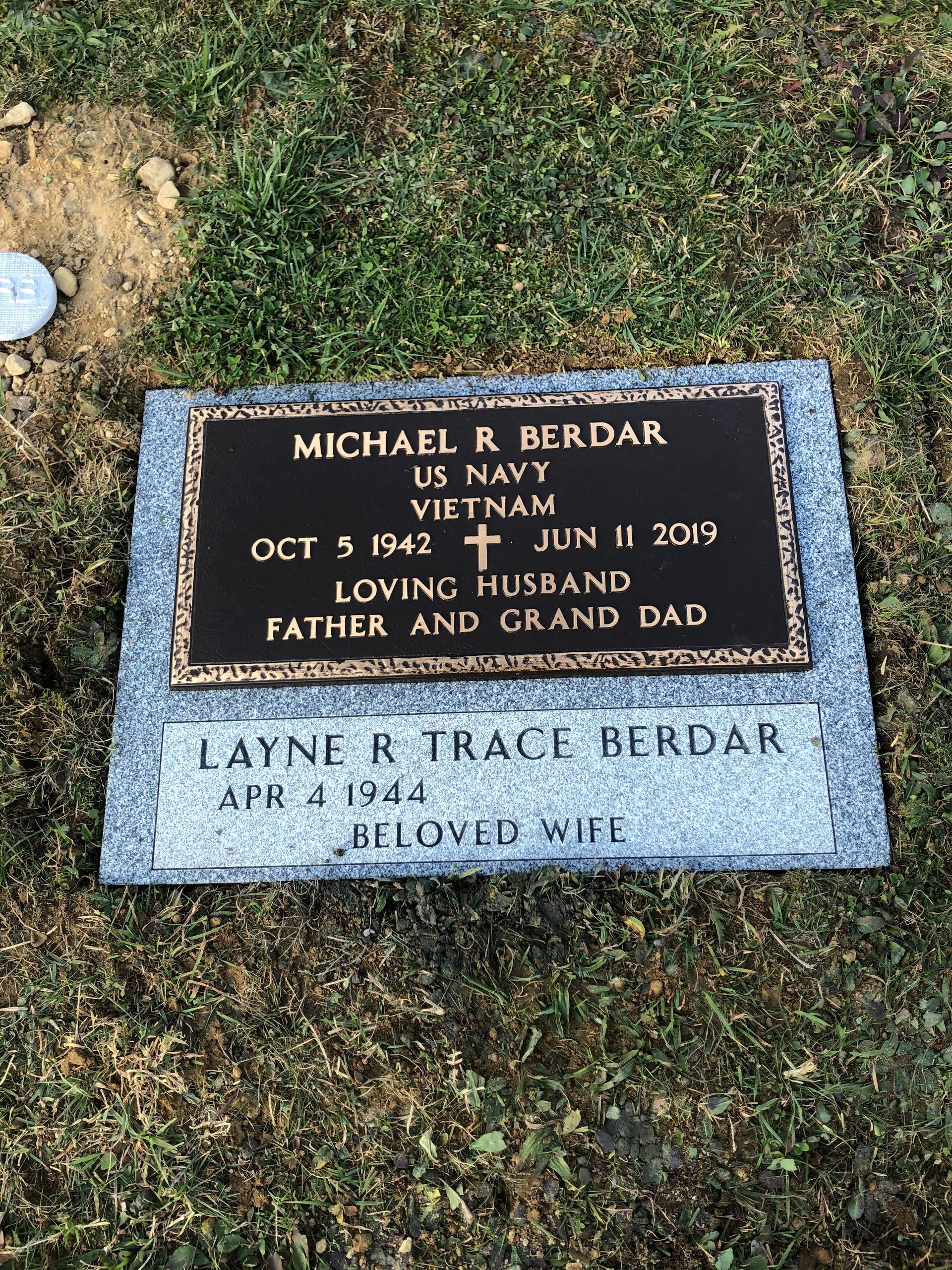 Gravestone for Michael R. Berdar and Layne Traci Berdar in a grassy cemetery plot, with an engraved plaque.