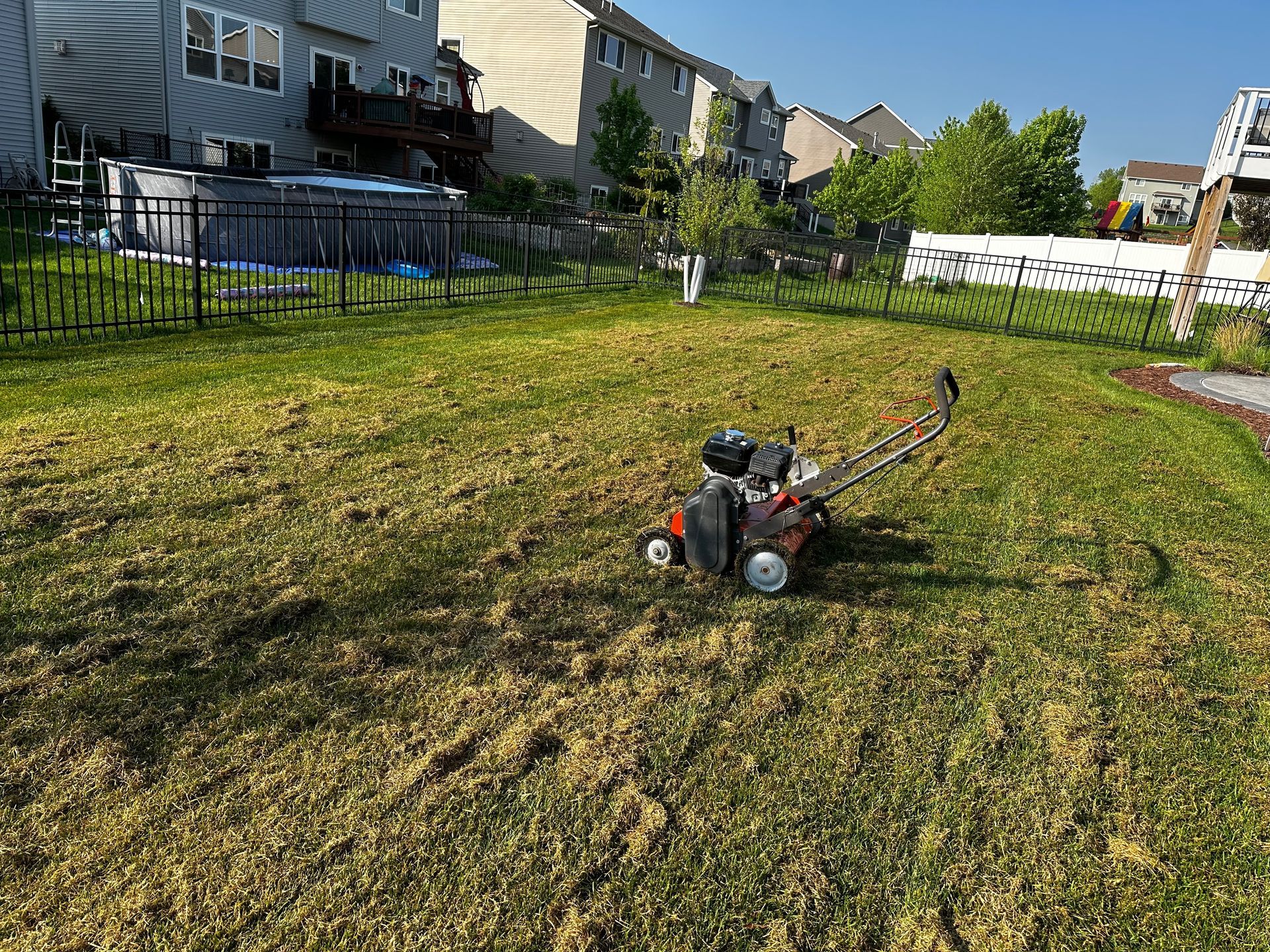 A field of grass with a lot of dirt on it.