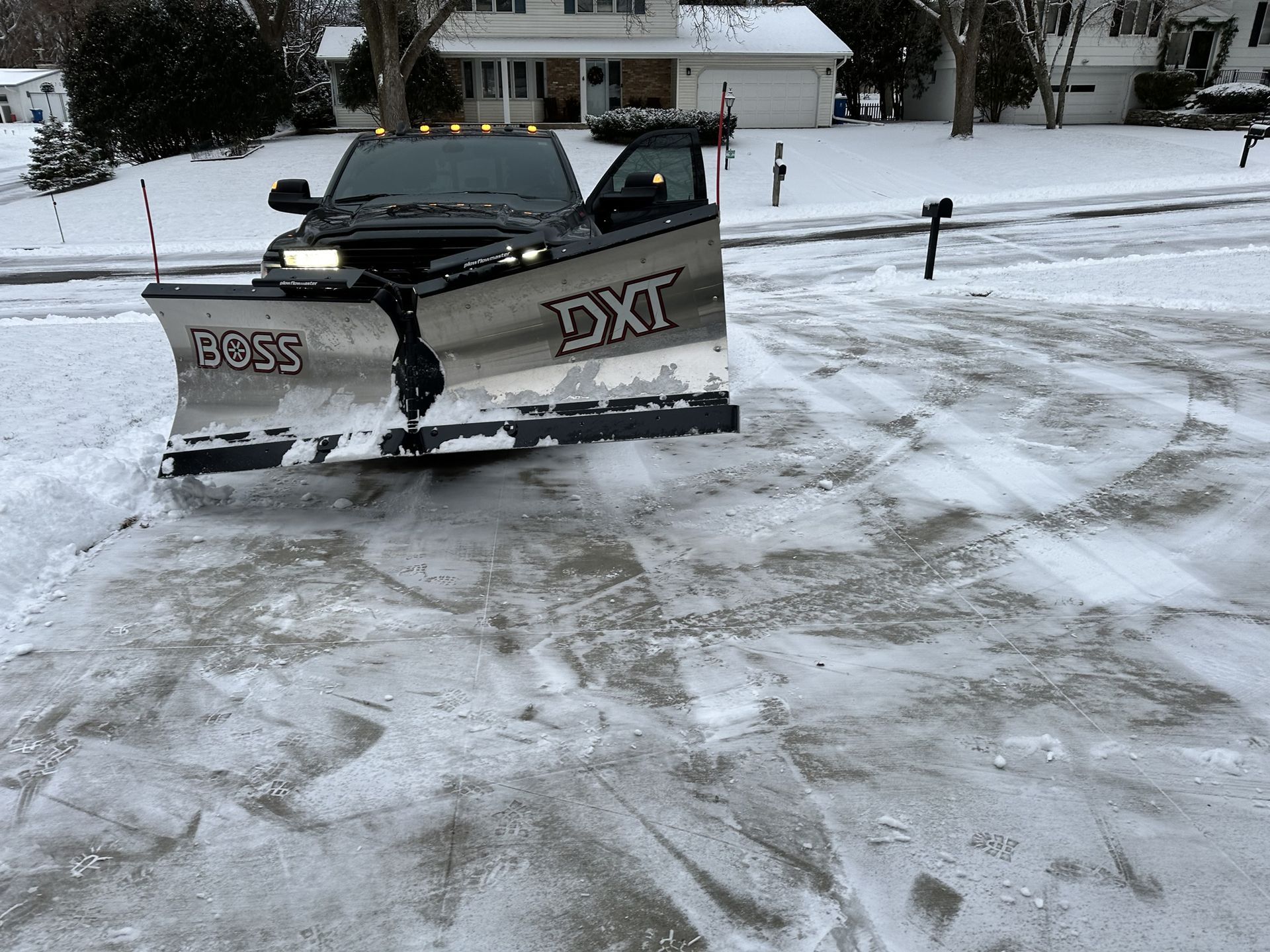 A snow plow with the word boss on it