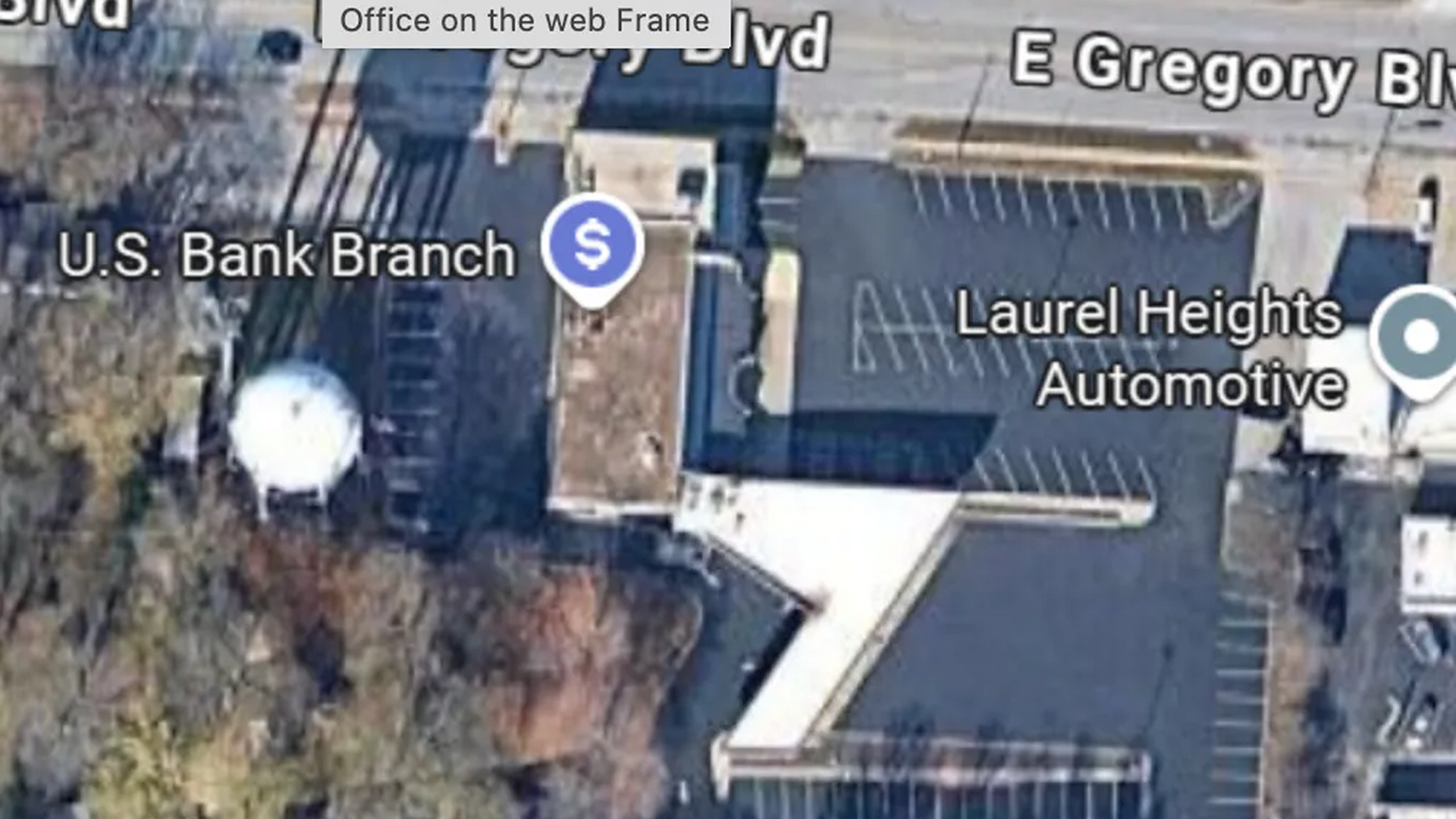 Aerial view of a U.S. Bank branch next to Laurel Heights Automotive on a city street.