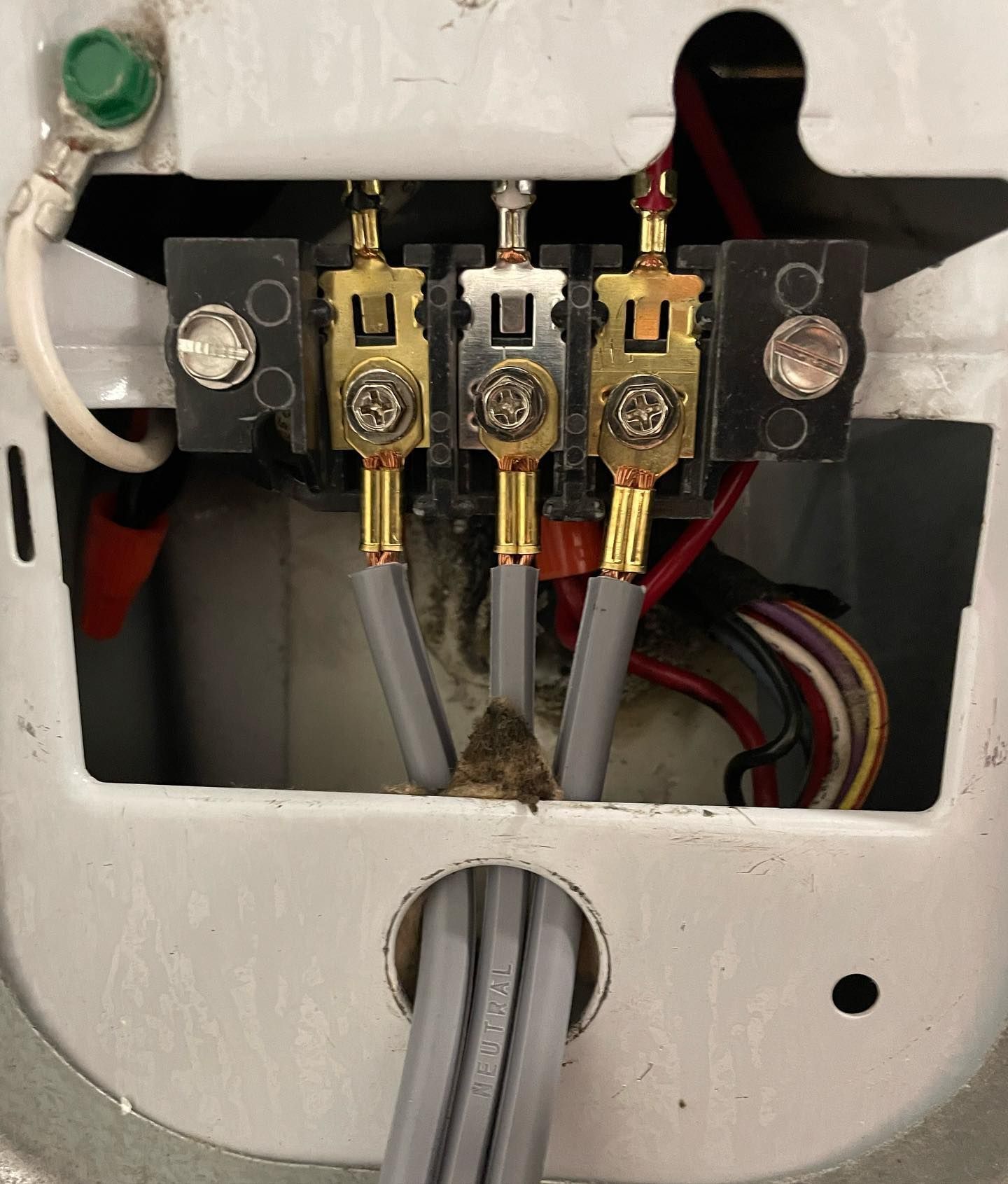 A bunch of wires are connected to a electrical outlet
