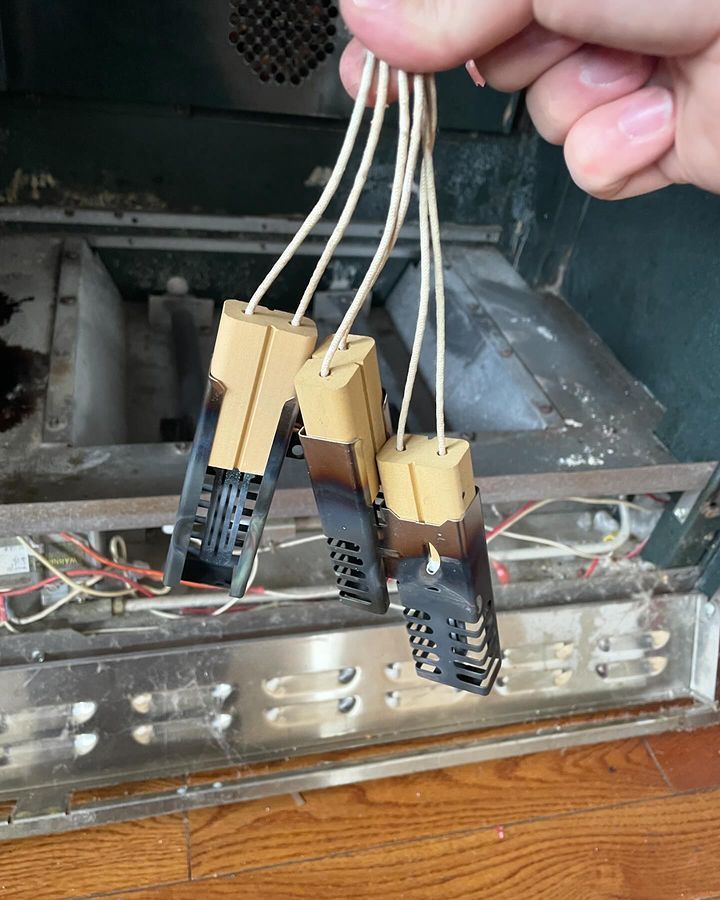A person is holding a bunch of wires in their hand.