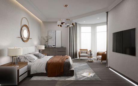 Camera da letto moderna con letto grande, TV a parete e luminosa zona salotto vicino alla finestra.