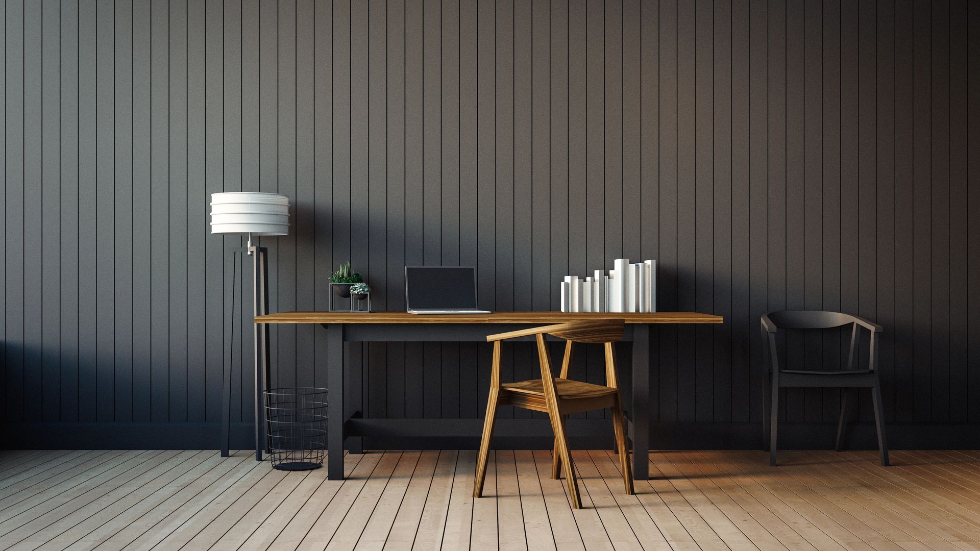 Ufficio domestico minimalista con scrivania, laptop, libri, lampada e sedia contro una parete rivestita di pannelli scuri.