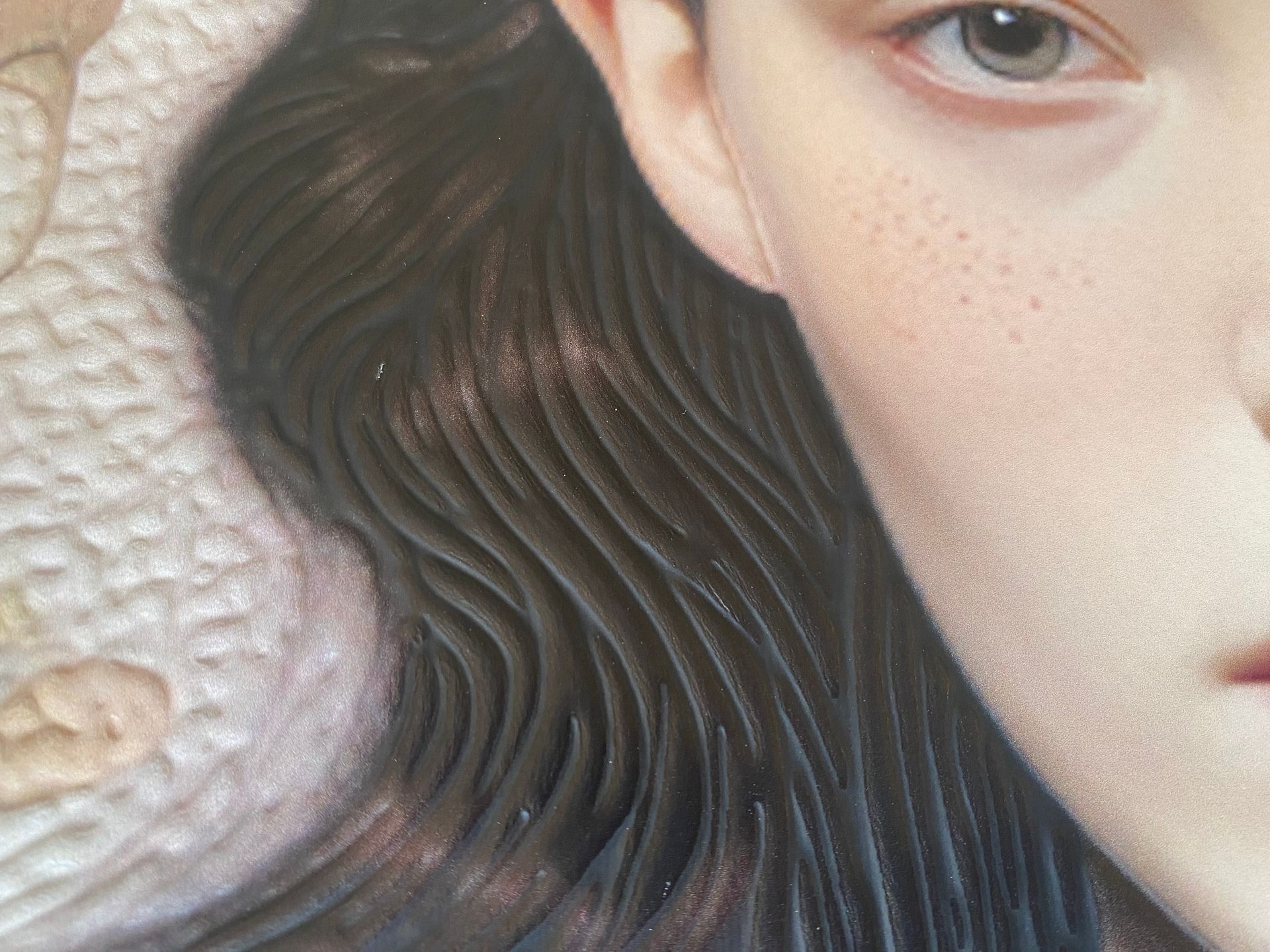 Conservator examining an artwork surface