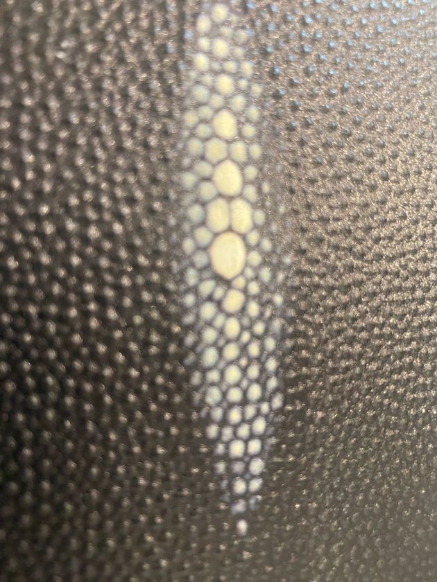 Embossed gold foil on textured packaging stock