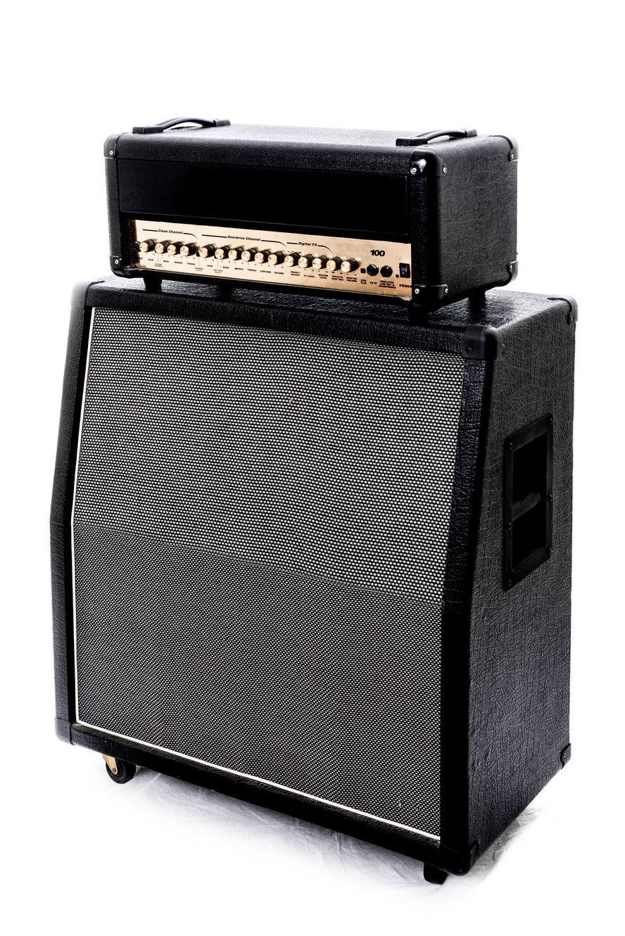 A black and white guitar amplifier with a speaker on top of it on a white background.